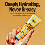 A hand holding a tube of SOFTY HAND CREAM CARAMELT with lotion on the fingers. Text above reads: Deeply Hydrating, Never Greasy. This silky finish hand moisturizer leaves hands smooth and comfortably hydrated without any stickiness.