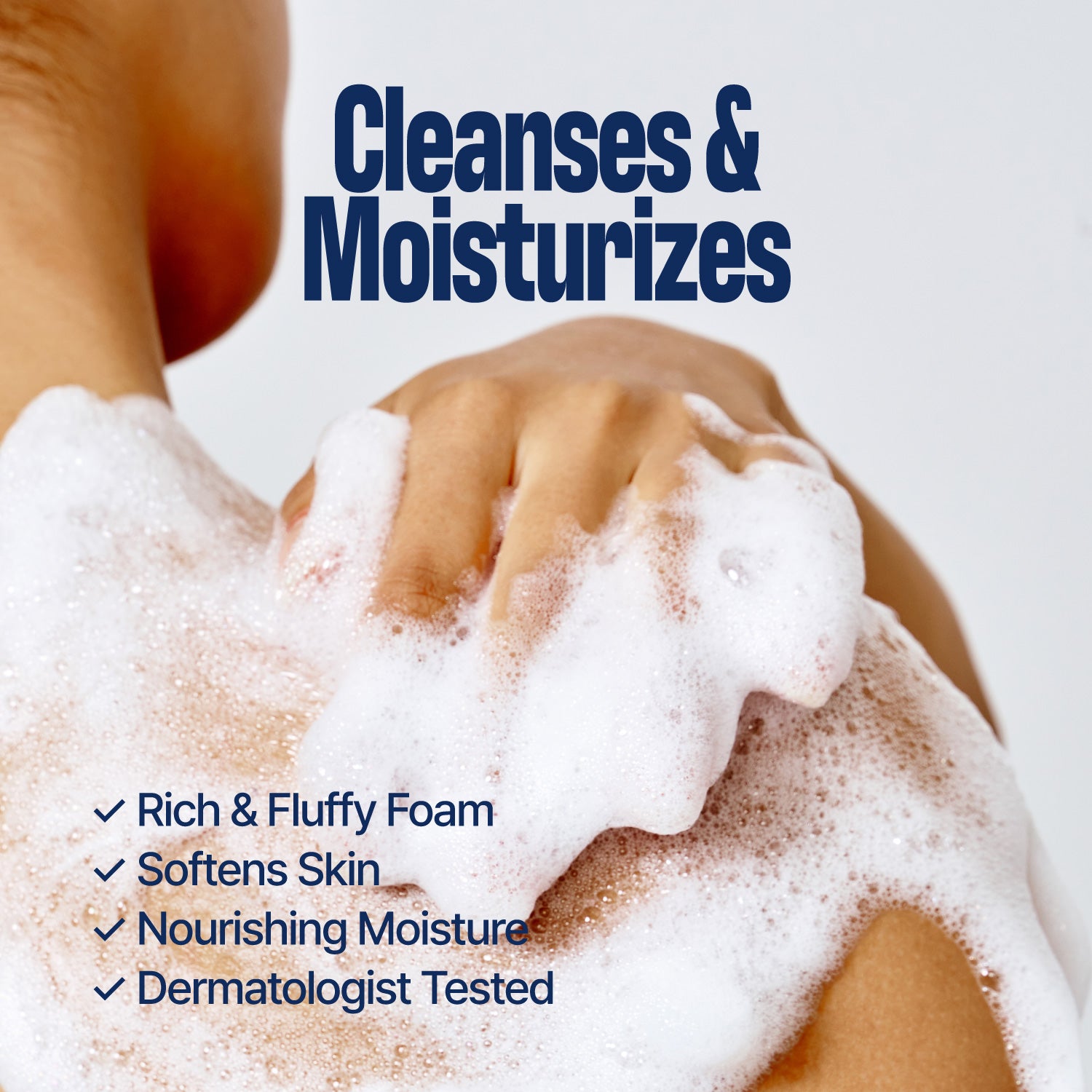 A person washes their shoulder with foamy soap. Blue text reads, Cleanses & Moisturizes. Below, a checklist highlights rich foam, softens skin, nourishing moisture, and dermatologist tested—showcasing the benefits of WHIPPING MILK WASH SEOUL VANILLA and its gentle, hydrating formula.