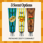 Three tubes of Knock Softy Hand Cream in Pistachio, Zesty, and SOFTY HAND CREAM CARAMELT scents on a checkered background, with the text “3 Scent Options” above and scent names below. Each serum-in-cream hand moisturizer provides a luxurious silky finish to keep your hands soft and hydrated.