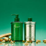Two bottles of skincare products on a green background with pistachios.